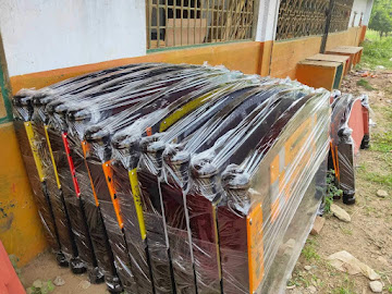 Stack of institutional school desk frames ready for delivery
