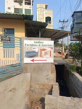 Andhra Furniture and Interiors signboard on Singh Nagar route