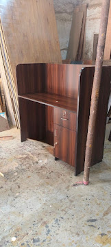 Executive wooden reception desk in workshop